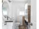 This bathroom offers a sleek vanity, toilet, and shower with neutral tile and modern fixtures at 4280 S Pearl St, Englewood, CO 80113