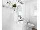 Bright bathroom features a modern vanity with a stylish oval mirror and clean, minimalist design at 4280 S Pearl St, Englewood, CO 80113