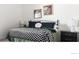 Stylish bedroom features a comfortable bed, side table and lamps at 4280 S Pearl St, Englewood, CO 80113