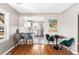 Cozy dining area with a table for four and bar seating connecting to the kitchen at 4280 S Pearl St, Englewood, CO 80113