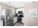 Modern kitchen features stainless steel appliances, granite countertops, and white cabinets at 4280 S Pearl St, Englewood, CO 80113
