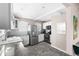 Bright kitchen features stainless steel appliances, white cabinets, granite countertops and stylish backsplash at 4280 S Pearl St, Englewood, CO 80113