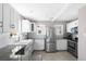 Updated kitchen featuring stainless steel appliances, a farmhouse sink and granite countertops at 4280 S Pearl St, Englewood, CO 80113