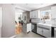 Bright kitchen with granite countertops, stainless steel appliances and breakfast bar at 4280 S Pearl St, Englewood, CO 80113