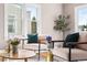 Living room with modern furnishings, stylish decor, and ample natural light at 4280 S Pearl St, Englewood, CO 80113