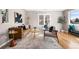 Bright living room features modern furniture, light wood floors, and a large window at 4280 S Pearl St, Englewood, CO 80113