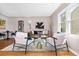 This living room has an open floor plan, hardwood floors, and modern decor at 4280 S Pearl St, Englewood, CO 80113