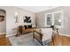 This living room has hardwood floors, modern decor, and big windows at 4280 S Pearl St, Englewood, CO 80113