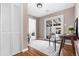 This bonus room features hardwood floors, white trim and a sliding door to the backyard at 4280 S Pearl St, Englewood, CO 80113