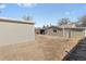 Spacious backyard features two-car garage and dirt area, ready to landscape at 1185 Worchester St, Aurora, CO 80011