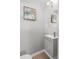 Cozy bathroom with modern vanity, mirror, and decorative painting at 1185 Worchester St, Aurora, CO 80011