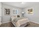 Comfortable bedroom with neutral walls, plush carpeting, and bright natural light from windows at 1185 Worchester St, Aurora, CO 80011