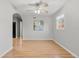 Open-concept dining area with hardwood floors, neutral walls, and ceiling fan at 1185 Worchester St, Aurora, CO 80011