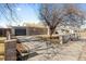 A single-story brick home featuring a paved driveway and decorative wrought iron fence at 1185 Worchester St, Aurora, CO 80011