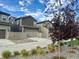 Modern home with a two-car garage, fenced yard, and well-maintained landscaping at 15600 Bolling, Denver, CO 80239