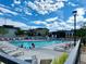 Community swimming pool with lounge chairs and blue skies, a refreshing outdoor space for relaxation and recreation at 15600 Bolling, Denver, CO 80239