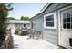 Backyard with a grill, patio table, chairs, and small deck off the back door at 6031 S Pennsylvania St, Centennial, CO 80121