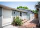 Backyard with a brick-lined walkway and a small garden with a white door to the house at 6031 S Pennsylvania St, Centennial, CO 80121