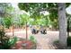 Backyard seating area with a fire pit, benches, and a large tree providing shade at 6031 S Pennsylvania St, Centennial, CO 80121