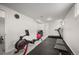 Spacious basement gym area with workout equipment and a small window at 6031 S Pennsylvania St, Centennial, CO 80121