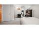 Finished basement bedroom with gray carpet, a large amp, and a door to another room at 6031 S Pennsylvania St, Centennial, CO 80121