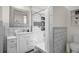 Modern bathroom with stylish tile work, a sleek vanity, and a well-lit shower area at 6031 S Pennsylvania St, Centennial, CO 80121