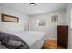 Bright bedroom with hardwood floors and large window, perfect for natural light and relaxing at 6031 S Pennsylvania St, Centennial, CO 80121