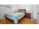 Serene bedroom with wood floors, a comfortable bed, and plenty of natural light, creating a tranquil retreat at 6031 S Pennsylvania St, Centennial, CO 80121