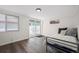 Bedroom with a door to the outside, offering a private entrance and easy access to outdoor spaces at 6031 S Pennsylvania St, Centennial, CO 80121