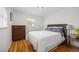 Cozy bedroom featuring hardwood floors, a bright window, and ample space for a comfortable setup at 6031 S Pennsylvania St, Centennial, CO 80121