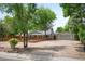 Charming home featuring a spacious front yard, complemented by a detached garage and inviting wooden fence at 6031 S Pennsylvania St, Centennial, CO 80121