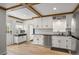 Bright kitchen with white cabinets, subway tile backsplash, and modern appliances, creating a clean and functional space at 6031 S Pennsylvania St, Centennial, CO 80121