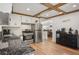 Modern kitchen featuring stainless steel appliances, sleek countertops, and stylish wood-look flooring at 6031 S Pennsylvania St, Centennial, CO 80121
