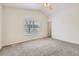 Bright bedroom with vaulted ceiling, neutral carpet and a view to backyard through the window at 22030 Hill Gail Way, Parker, CO 80138