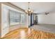 Bright and airy dining area with wood floors and natural light streaming through large bay windows at 22030 Hill Gail Way, Parker, CO 80138