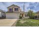 Charming two-story home featuring red shutters, a two-car garage, and a well-maintained front yard at 22030 Hill Gail Way, Parker, CO 80138