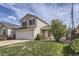 Charming two-story home featuring red shutters, a two-car garage, and a well-maintained front yard at 22030 Hill Gail Way, Parker, CO 80138