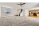 Spacious open-concept living room showcasing plush carpeting and staircase to the upper level at 22030 Hill Gail Way, Parker, CO 80138