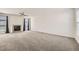 Spacious living room featuring a fireplace, large windows and plush carpeting at 22030 Hill Gail Way, Parker, CO 80138