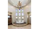 Bright bathroom with a soaking tub, travertine floors, and a wall of windows at 3120 Bears Den Dr, Sedalia, CO 80135