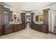 Bathroom featuring dual sinks and dark wood cabinetry at 3120 Bears Den Dr, Sedalia, CO 80135