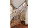 Stairway with wood steps and stone walls at 3120 Bears Den Dr, Sedalia, CO 80135