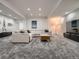 Spacious basement with comfortable sectional, neutral carpet, and great lighting for entertaining or relaxing at 338 Saint Paul St, Denver, CO 80206
