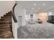 Open basement area with plush carpeting, recessed lighting, and a comfortable seating arrangement at 338 Saint Paul St, Denver, CO 80206