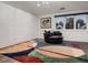 Bright dressing room featuring a swivel chair, built-in closet, and striking rug, perfect for relaxation at 338 Saint Paul St, Denver, CO 80206