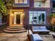 Inviting front porch with stylish seating, brick facade, and a modern glass-paneled entryway at 338 Saint Paul St, Denver, CO 80206
