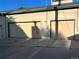 Exterior shot of a multi-car garage with tan siding, providing ample parking and storage at 338 Saint Paul St, Denver, CO 80206