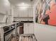 Convenient laundry room with modern washer and dryer, ample cabinet space, and stylish decor at 338 Saint Paul St, Denver, CO 80206