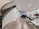 Open-concept floor plan with hardwood floors, spiral stairs, and a modern kitchen at 338 Saint Paul St, Denver, CO 80206