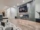 Cozy living room with a modern fireplace, large television, and hardwood floors at 338 Saint Paul St, Denver, CO 80206